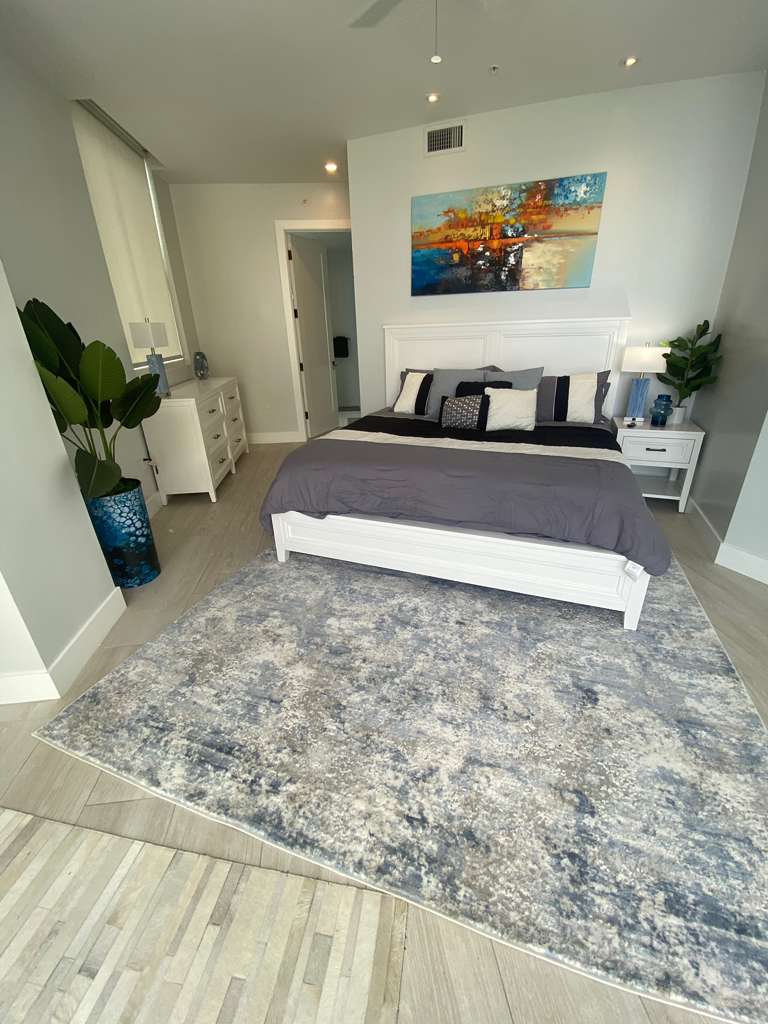 Bedroom after professional interior design and rental property styling