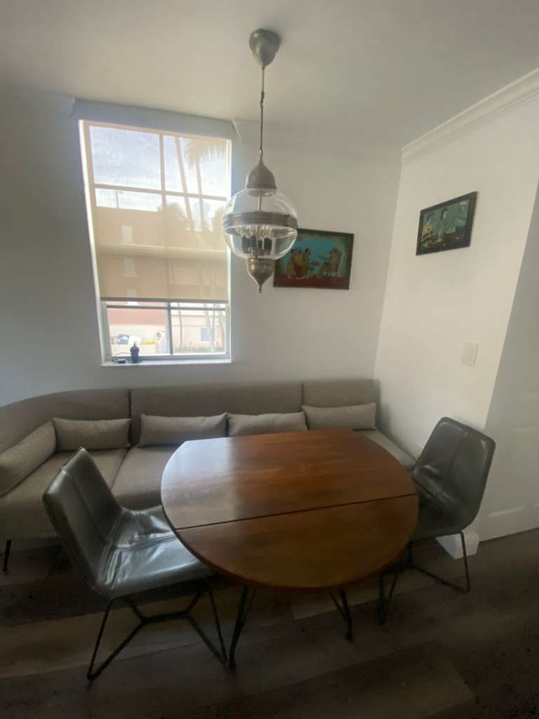 Dining area before rental property styling transformation